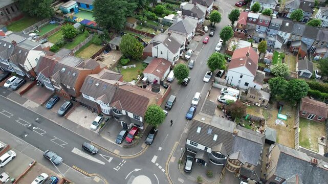Aerial View of British City During Mostly Cloudy Day. Urban Drone Flight Above Streets of British City and Town of England Great Britain. Drone Mounted Camera Footage Was Captured From Medium Altitude