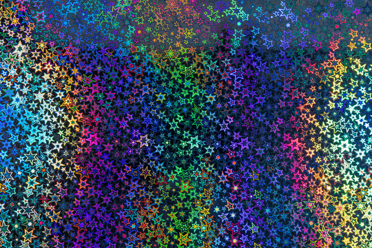 Multicolored holographic star pattern with iridescent reflective gradient texture