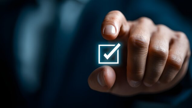 Businessman hand touching virtual checkmark box on screen.