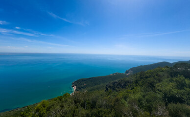 Fototapeta premium Panoramic aerial view of Arrabida beach. Rocky seascape. Creiro beach. Setubal region, Atlantic Ocean, Portugal