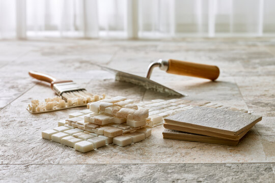 Tile Samples Trowel and Spacers on Renovation Floor