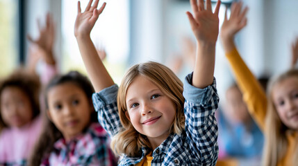 Fototapeta premium Close-up of a diverse group of elementary school girls with hands raised high in a modern sunlit classroom, girls in education concept, sunlit classroom photography, eagerness