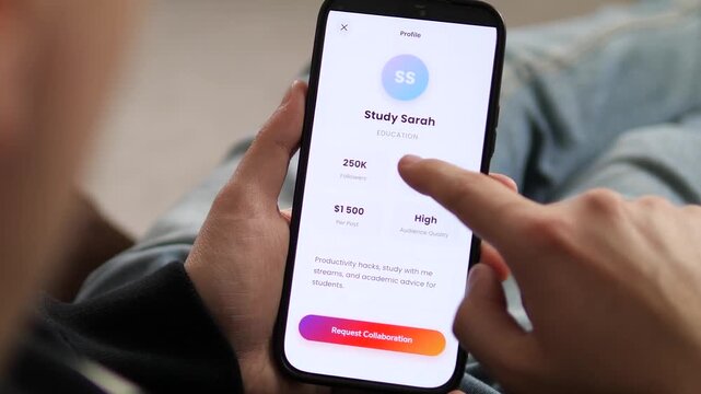 Marketing manager uses an influencer marketplace app to find digital creators. Scrolling through niche profiles with engagement data and pricing. Perfect for creator economy, digital ads, and B2B tech