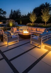 Obraz premium luxurious outdoor patio at dusk featuring modern fire pit surrounded by comfortable lounge furniture. backyard landscaping with illuminated trees and stone paving. exterior home design, real estate.