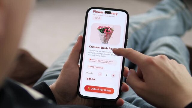 Effortless gifting: customer selects fresh roses on a smartphone delivery service. High-quality visual of digital shopping and express floral services. Essential for holiday ads and tech-driven