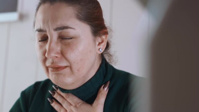 Woman releases feelings during counseling session. Woman shares vulnerability through tears and trust. Caucasian woman in counseling context reveals deep feelings through tears and quiet breaths