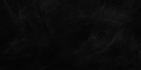 Fototapeta premium Black texture background with subtle abstract chalk brush strokes or dark concrete wall stone surface for backdrop. moody dark abstract background texture resembling chalk or charcoal smudges