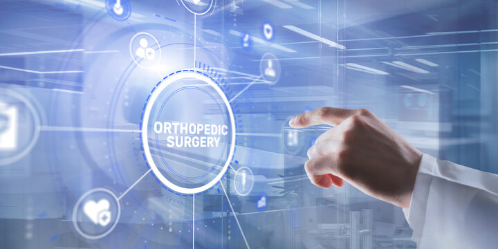 A doctor's hand in a medical coat presses the ORTHOPEDIC SURGERY button on a digital interface