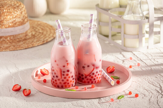 Cold and homemade strawberry bubble tea with milkshake and balls.