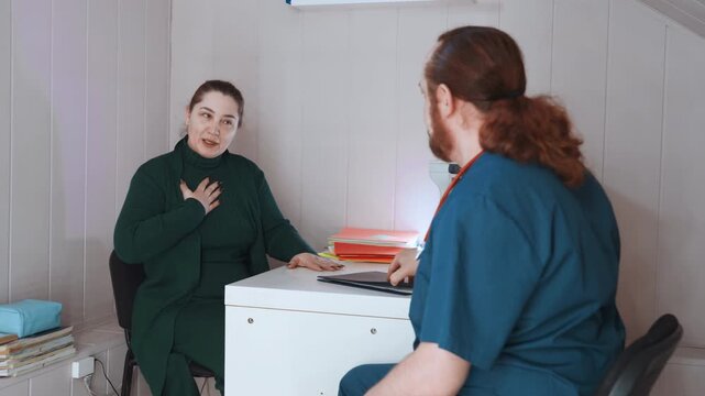 Paramedic home visit consultation patient clutching chest nurse assessing breathlessness in cozy living room with desk paperwork concerned expression supportive dialogue calm lighting