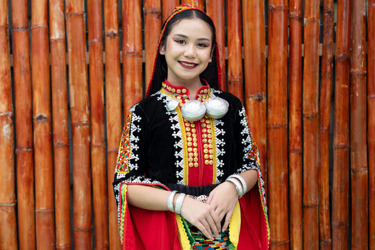 Portrait of young girl smiling wearing complete set of Dusun Tindal Clothes Sinipak during Kaamatan Harvest Festival