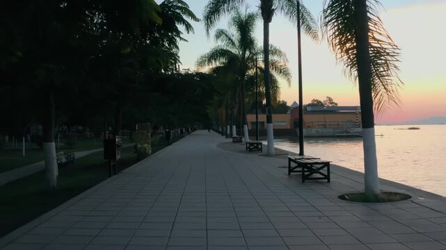 Ajijic Mexico Boardwalk at Sunset with Palm Trees and Lake Chapala Views