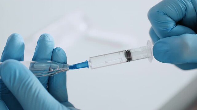 Calm nurse prepares injection. Tranquil healthcare worker giving vaccination carefully. Patient experiences soothing touch as gentle nurse provides necessary vaccination during home visit