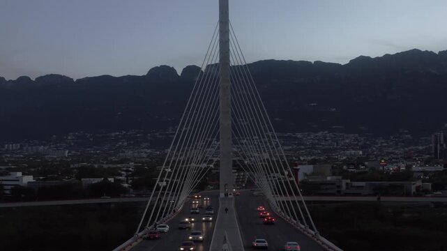 Monterrey Mexico iconic bridge at dusk with traffic and city lights World Cup host city