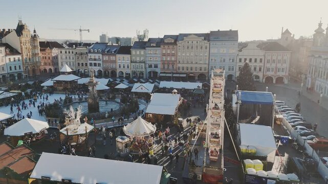 Aerial View of Festive Christmas Market Stalls and Large Ferris Wheel in Cesky Krumlov Square
