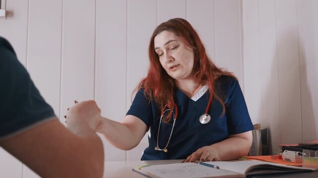 White nurse at home desk assessing patient, red hair, stethoscope on neck, clipboard and paperwork on table, calm empathetic conversation, domestic interior, caregiver explaining care plan