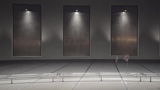 Michigan Law Enforcement Officers Memorial Interior Dark Wall Panels Spotlights Somber Tribute Indoor Night