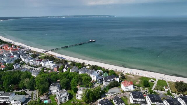 Aerial footage of the seaside resort of Binz on Germany&rsquo;s Baltic Sea coast, featuring the sweeping Binzer Bucht (Binz Bay) on the Island of R&uuml;gen.