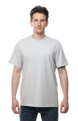 Handsome young man wearing blank t-shirt on white background. Mockup for design