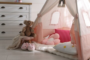 Cute wigwam, cushions and toy in stylish child's room © New Africa