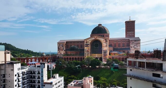 Aparecida National Shrine in Brazil with cable cars and historic architecture, showing a famous Catholic pilgrimage destination.