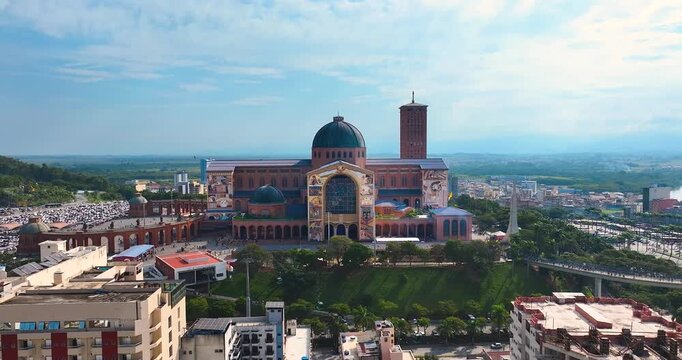 Aparecida National Shrine in Brazil with cable cars and historic architecture, showing a famous Catholic pilgrimage destination.