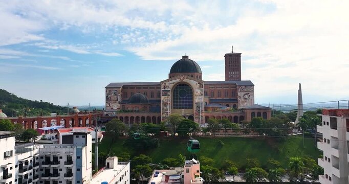 Aparecida National Shrine in Brazil with cable cars and historic architecture, showing a famous Catholic pilgrimage destination.