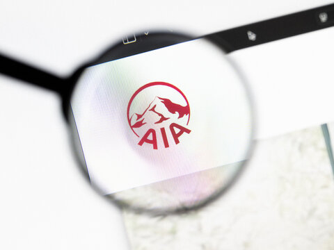 Milan, Italy 2026, 20 Apr Closeup of AIA Group website on a laptop screen. AIA Group logo under a magnifying glass.
