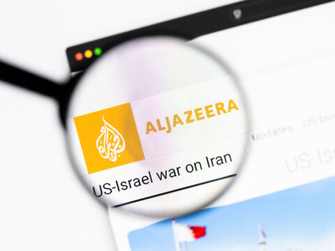Milan, Italy 2026, 20 Apr Closeup of Al Jazeera website on a laptop screen. Al Jazeera logo under a magnifying glass.