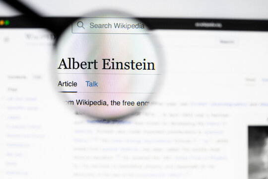 Milan, Italy 2026, 20 Apr Closeup of Albert Einstein website on a laptop screen. Albert Einstein logo under a magnifying glass.