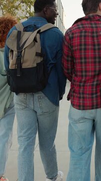 Diverse group of students walking on university campus