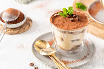 Authentic Italian Tiramisu Cup with Golden Spoons © anammarques