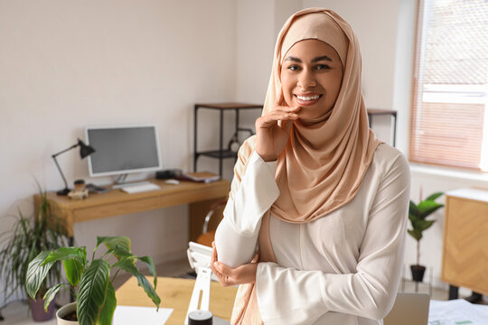 Portrait of Muslim businesswoman in office