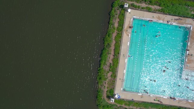 People in swimming pool aerial view