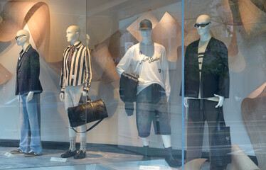Naklejka premium display window with mannequins at Harry Rosen, a men's clothing store, located at 82 Bloor St W, Toronto - featuring so-called latest fashion for men