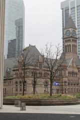 Naklejka premium Podium Roof Flagpole (or Courtesy Flagpole) located at edge of the elevated podium roof at Toronto City Hall, 100 Queen St W (with view of green roof, Old City Hall)