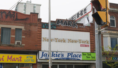 Naklejka premium facade with signs at 985 Bloor St W, location of Jankie's Place / New York New York Business Club, Toronto