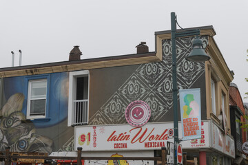 Naklejka premium exterior building mural and signs of Latin World and Mexican Restaurant, located at 1262 Bloor St W at Emerson Av, Toronto