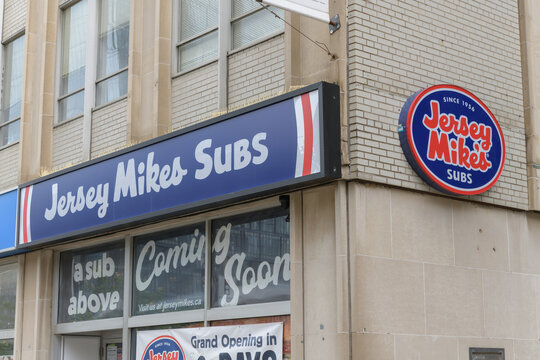 Coming Soon signs at Jersey Mike's Subs, a sandwich shop chain, located here at 425 University Av, Toronto