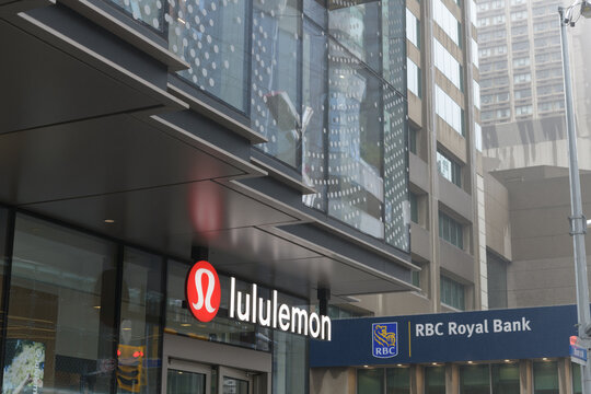 exterior building and sign of lululemon, a sportswear store, located at 2 Bloor St W and RBC, Royal Bank located at 2 Bloor St E, Toronto