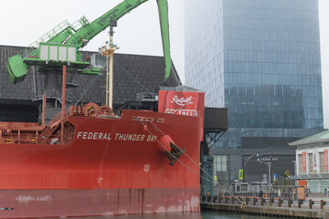 Naklejka premium The Federal Thunder Bay, a modern bulk carrier ship, docked at the Redpath Sugar Refinery in Toronto - bow end