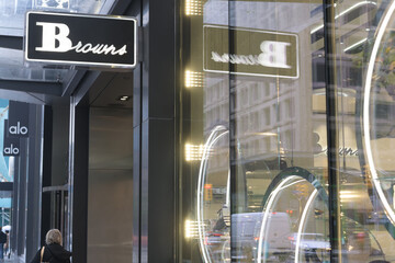 Naklejka premium abstract exterior shop windows and projecting sign at Browns, a shoe store, located at 60 Bloor St W, Toronto