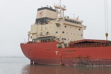 Naklejka premium The Federal Thunder Bay, a modern bulk carrier ship, docked at the Redpath Sugar Refinery in Toronto - deckhouse or superstructure
