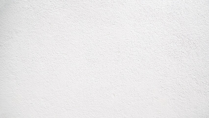 Obraz premium Abstract beige stucco wall texture background with a subtle rough finish and copy space.