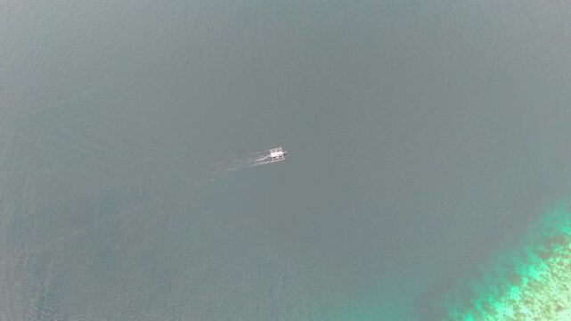 Aerial View of Boat Sailing Over Calm Waters &ndash; Coron Palawan