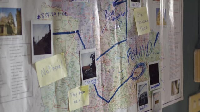 Criminal tracking wall with marker lines on northeastern Thailand map, mystery concept.