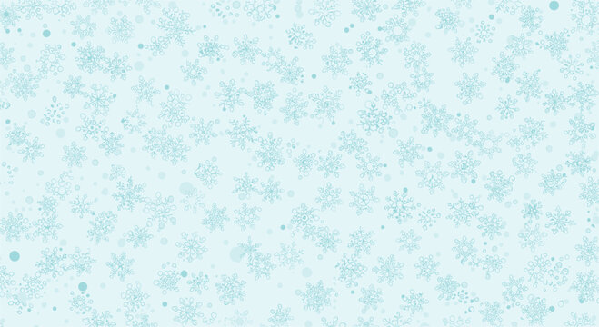 Delicate winter background filled with small light blue snowflakes of various shapes and sizes on a soft pale blue field.