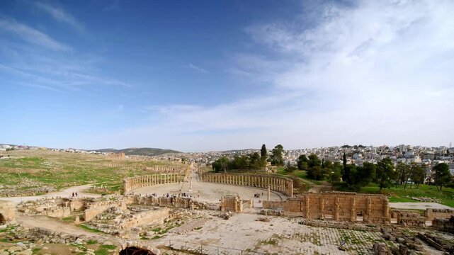 timelapse of the ancient Roman ruins in Jerash, Jordan. Clouds moving fast over the archaeological site of Gerasa, Greco-Roman architecture, columns and historical monuments