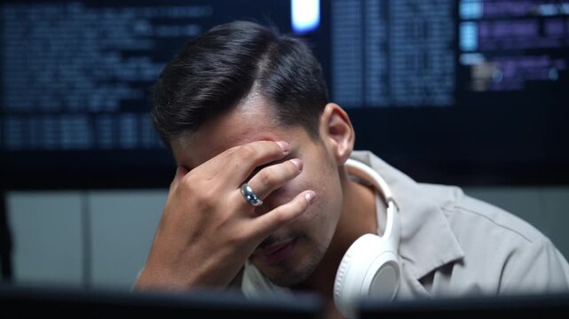 AI software developer experiencing stress while monitoring machine learning systems and coding projects. Programmer facing debugging challenges, cybersecurity issues, and technology pressure.