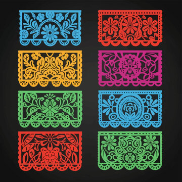 Colorful Mexican papel picado banners with intricate floral and foliate cutout designs in blue, red, yellow, pink, and green, arranged in two columns on a dark charcoal background.